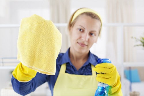 Technician treating a pet stain on carpet in a Sutton home