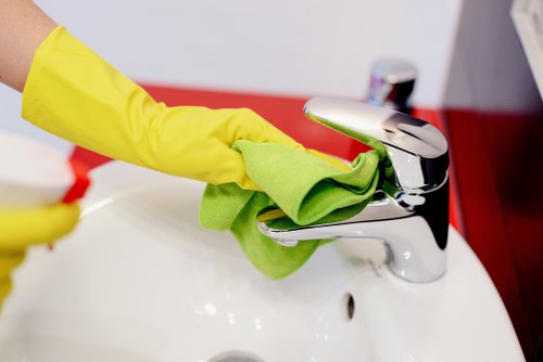 Team member using protective equipment during cleaning work
