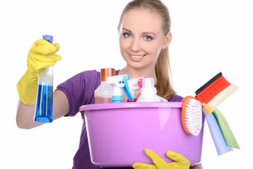 Cleaning a kitchen during a routine Sutton visit