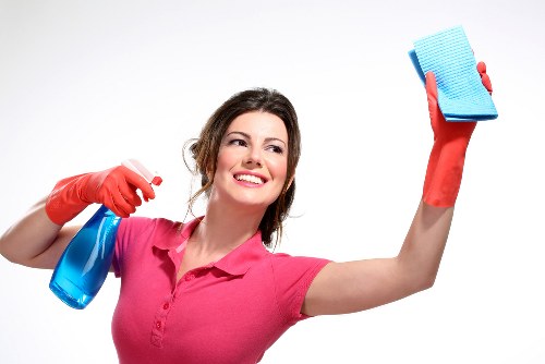 Deep cleaning a hard floor in a Sutton residential hallway